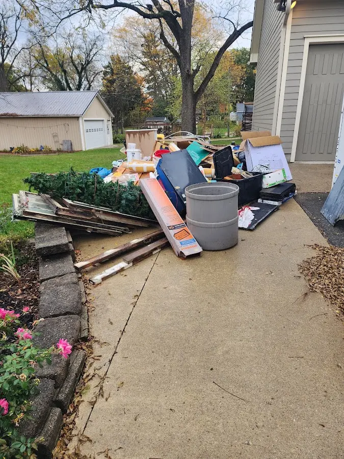 Dumpster being loaded with debris for 3 Yard Dumpster Rental in Williamstown
